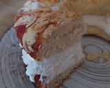 A picture of step 9 of Roscón de Reyes 2025 v2: With Almonds, Sugar, and Whipped Cream Filling.