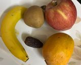 A picture of step 1 of Mango Apple Chikoo Banana & Date Smoothie.