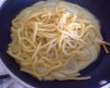 Foto del passaggio 4 della ricetta Bigoli con crema di zucchine, zucchine e cipollotti brasati