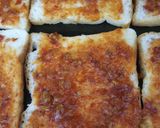 A picture of step 3 of Masala cheese and corn toast.