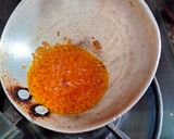 A picture of step 4 of Bathua saag tempered with ajwain,ginger & red chilli powder.