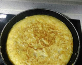 Foto del paso 6 de la receta: Tortilla de patata con pimientos del padrón