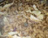 A picture of step 6 of Twist macaroni jollof.