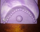A picture of step 8 of Oreo cake covered in fondant.