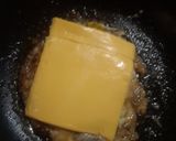 A picture of step 4 of 15 Cent Diner Fried Egg Sandwich with cheese.