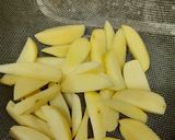 A picture of step 1 of Brinjal potato curry.