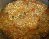 A picture of step 2 of Spicy maggie with lots of veggies.