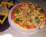 A picture of step 6 of Corn and capsicum pizza.