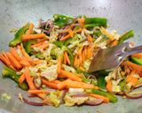 A picture of step 3 of Veg Noddles with dry manchurian balls.