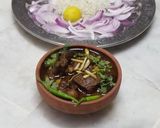 A picture of step 8 of Alo baingan gosht (mutton gravy).