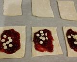 A picture of step 8 of Raspberry White Chocolate Pastry Strudels.