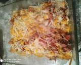 Foto del paso 4 de la receta Patatas fritas con bacon, jamón y queso rallado