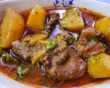 A picture of step 6 of Aloo Gosht.