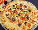 A picture of step 7 of Cheesy Bites Chicken Tikka Pizza 🍕🧀🍕🧀🍕.