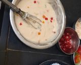 A picture of step 3 of Christmas special vanilla tutti fruti cup cakes.