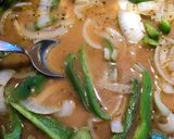 A picture of step 7 of Smothered Pork Chops.