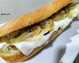 Foto del paso 5 de la receta: Bocadillo de lomo con queso, cebolla y ajoaceite