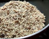 A picture of step 2 of Wheat flour seeds and nuts Ladoo with leftover ghee residue.