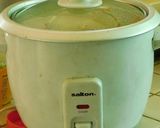 A picture of step 3 of Ellu satham (ellorai in Tamil)-Rice cooked with sesame seed masala powder.