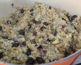 A picture of step 13 of Roast boneless chicken with chestnut, cranberry, apple, brown rice and rum stuffing.