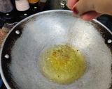 A picture of step 1 of Onion rice with tadka raita.