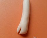 A picture of step 10 of Vickys Great White Shark Cake.