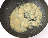 A picture of step 3 of Naan with masala paneer.