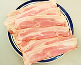 Foto del paso 6 de la receta: Tostas con espárragos envueltos en bacon y queso fundido