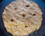 A picture of step 4 of Arrowroot mix thalipeeth with white butter.