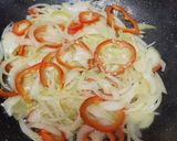 A picture of step 1 of King prawns & pointed peppers biryani.