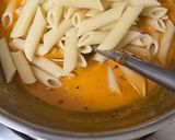 A picture of step 9 of Red sauce cheesy pasta.