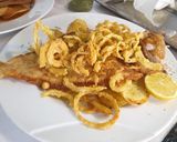 A picture of step 5 of Fried European Sole on a Bed of Potatoes and Garlic with Onion Rings.