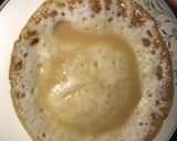 A picture of step 8 of Appam with coconut milk.