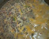A picture of step 3 of Spicy lentils (kamande)in milk and cinnamon raisins chapati.