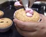A picture of step 6 of Strawberry short cupcake with strawberry ice cream frosting.