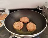 A picture of step 6 of Bring-a-smile chicken burgers with blue cheese or pesto filling 😊.