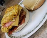 A picture of step 4 of Four Meat, Four Cheese Bagel Breakfast Sandwich.