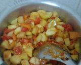 A picture of step 6 of Matoke/bananas with potatoes and avocado.