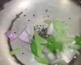 A picture of step 2 of Turaii (Ridge gourd) with kalonji and curry leaf.