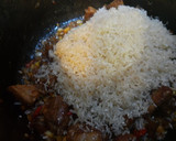 Foto del paso 4 de la receta: Arroz con chuleta de cerdo y maíz tierno