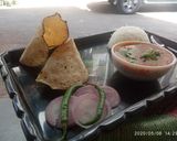 A picture of step 5 of Rajma rice with papad and onion salad.
