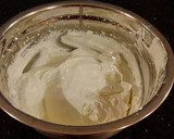 A picture of step 9 of Hazelnut Layer Cake with Hazelnut Cream Frosting.