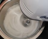 A picture of step 2 of Tiramisu with whipping cream.