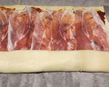 A picture of step 2 of Sun-dried tomato and prosciutto tear and share.