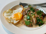 Grilled pork loin served with rice & fried egg