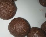 A picture of step 4 of Marie Cocoa balls with almonds inside.