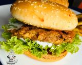 A picture of step 4 of Zinger burger with fries.