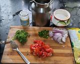 A picture of step 1 of Besan onion tomato chilla.