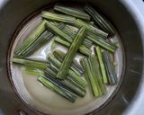 A picture of step 1 of Besan Drumstick curry.