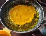 A picture of step 4 of Mango malpua with fresh cream.